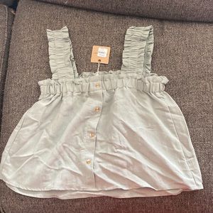 crop top, very lose fitting, light sage green. comes with a button